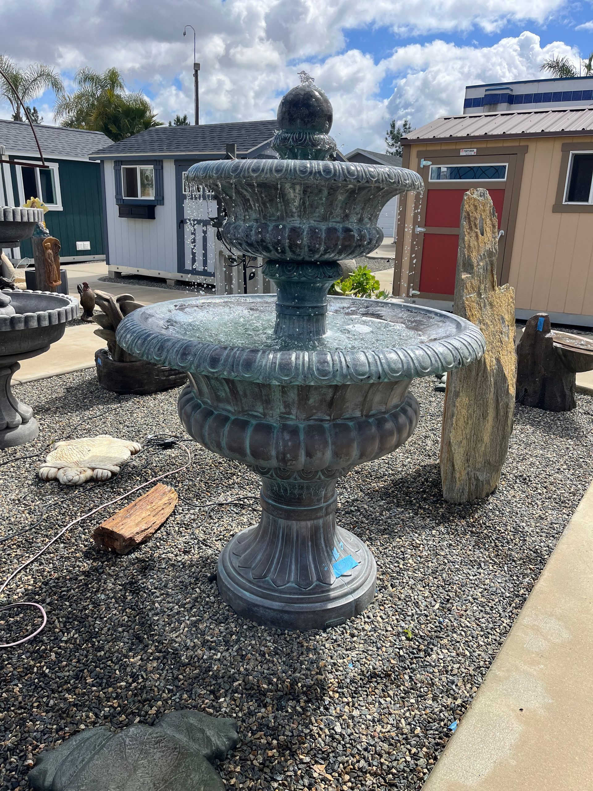 Teal cast stone tiered fountain