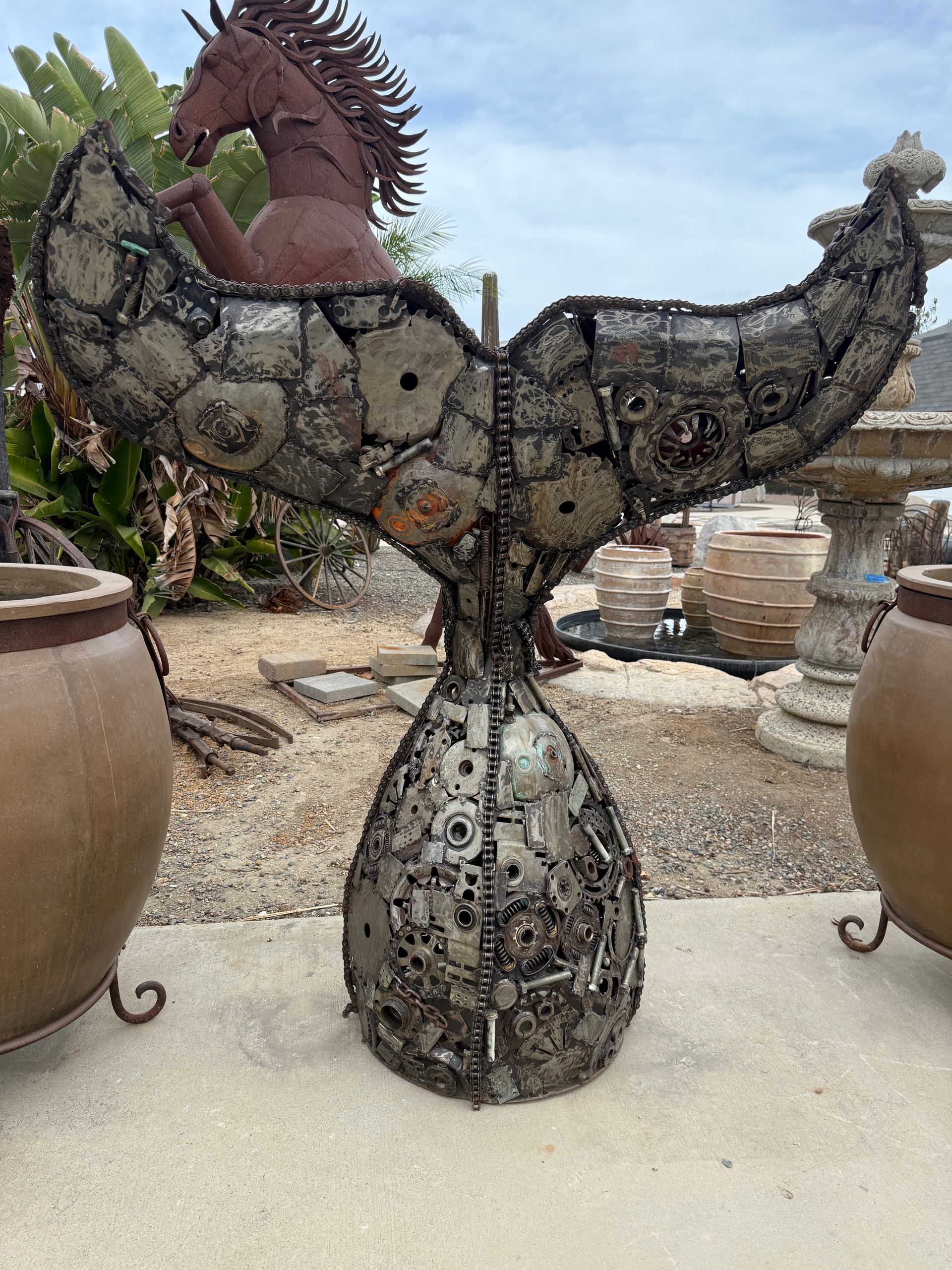 Recycled metal whale tail sculpture