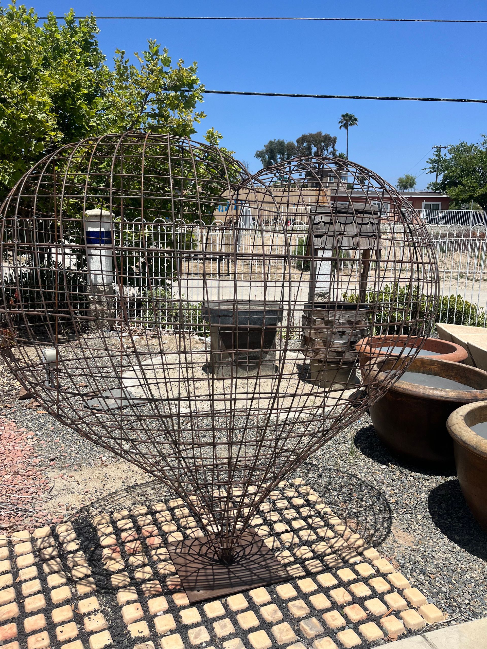 Woven steel garden spheres