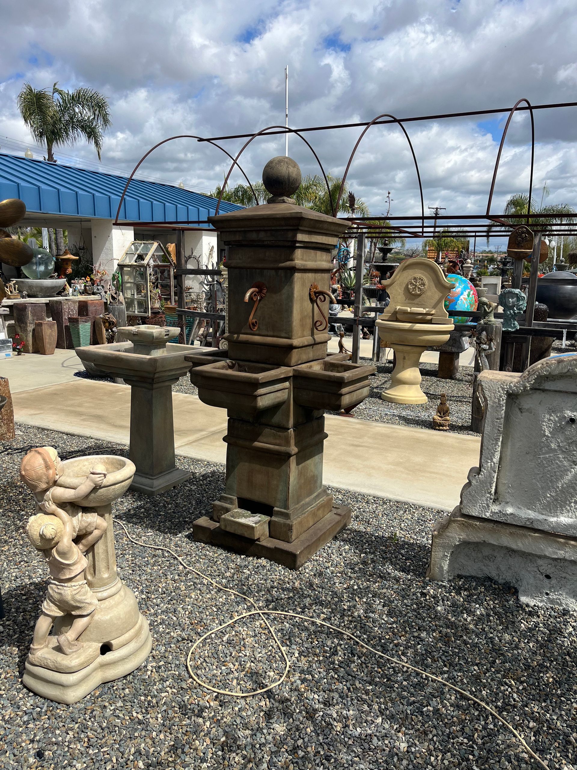 Cast stone fountains and columns on display in the showroom
