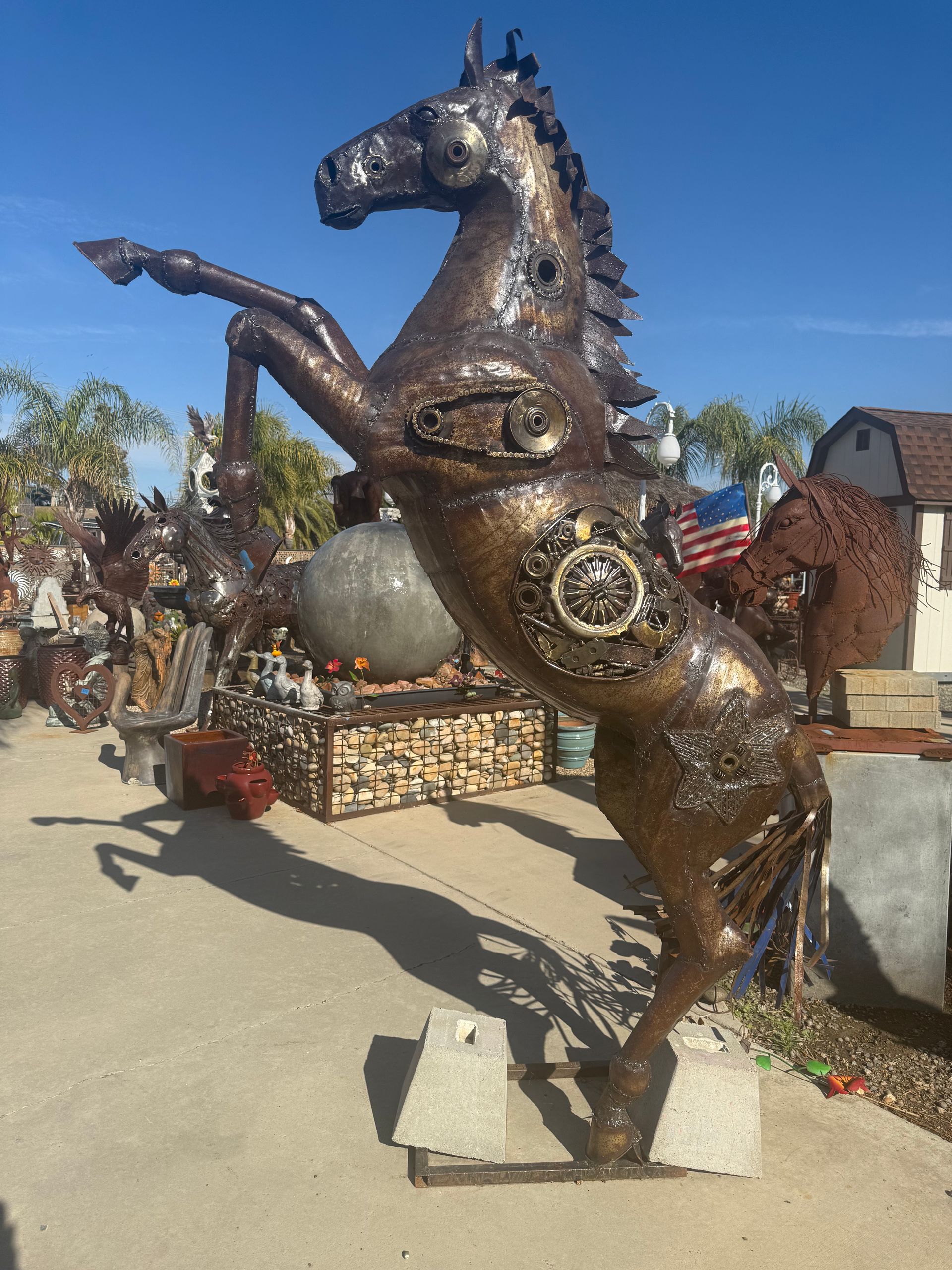 Rearing bronze-finish metal horse sculpture
